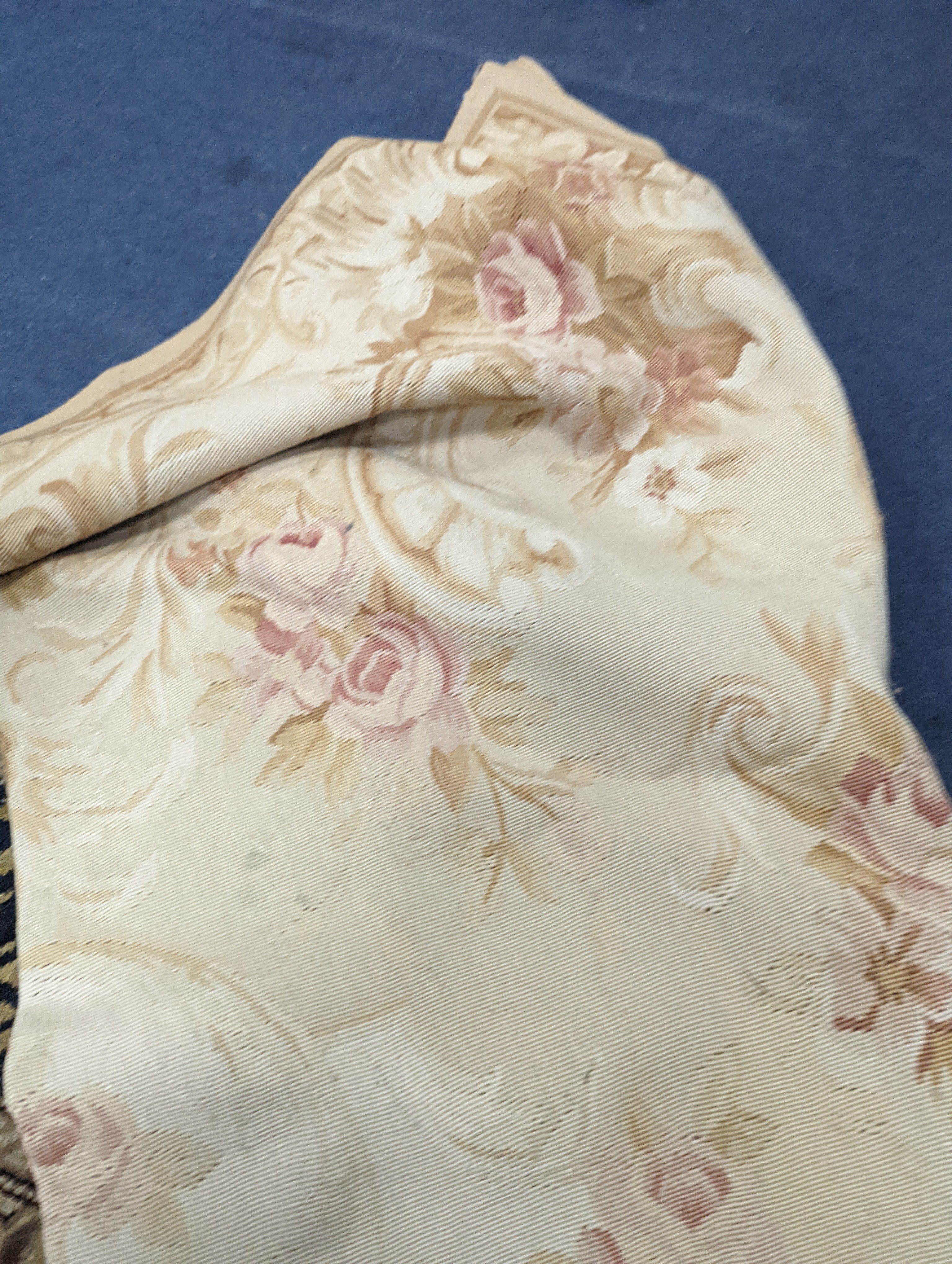 An Aubusson gold ground rug with rose pattern, 244 x 153cm